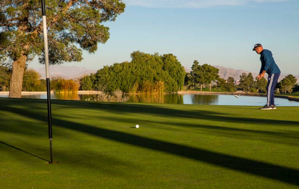 Golfer Tama Mamaia sends a putt towards the pin at hole #2 on the Mountain Course at Angel Park ...