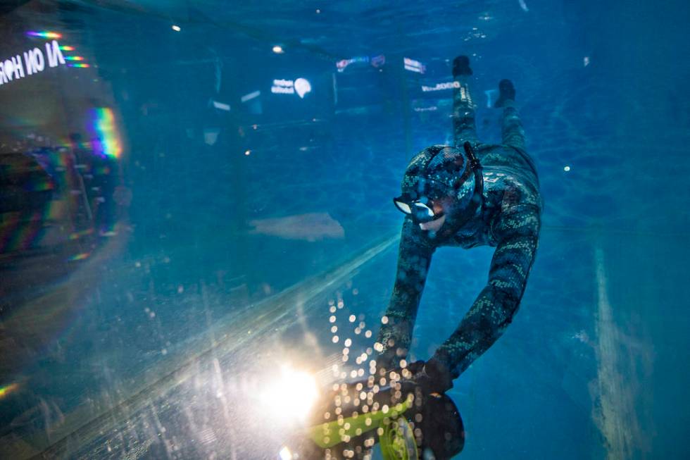 A man demonstrates the Seabow underwater scooter made by Sublue at CES at the Las Vegas Convent ...