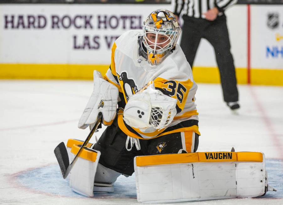 Pittsburgh Penguins goaltender Tristan Jarry makes a stop against the Vegas Golden Knights duri ...