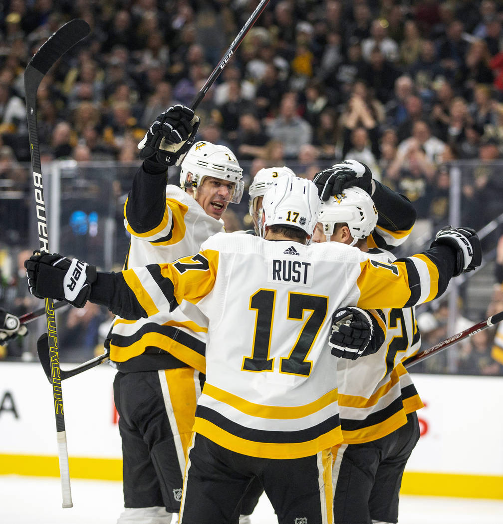 Pittsburgh Penguins' Bryan Rust (17) celebrates a goal with teammates during the first period o ...