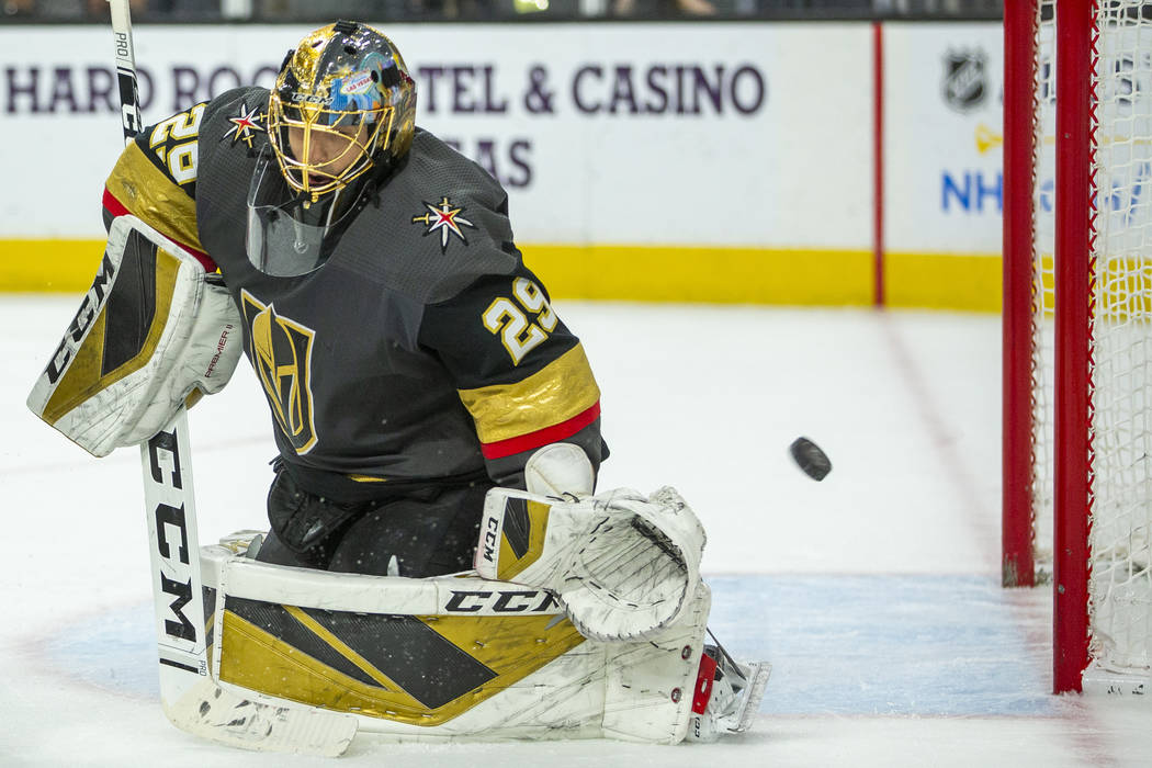 The puck goes past Vegas Golden Knights goaltender Marc-Andre Fleury (29) on a shot by the Pitt ...