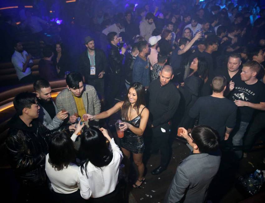 Conventioneers and clubgoers during the CES 2020 official opening party in the Main Room at Omn ...