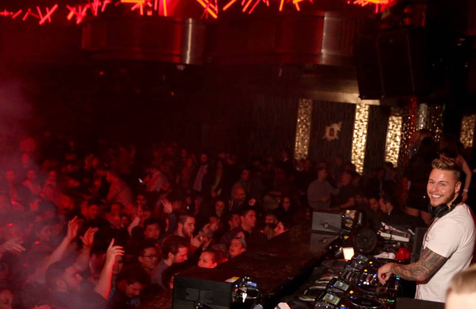 Conventioneers and clubgoers dance to DJ Mark Eteson during the CES 2020 official opening party ...