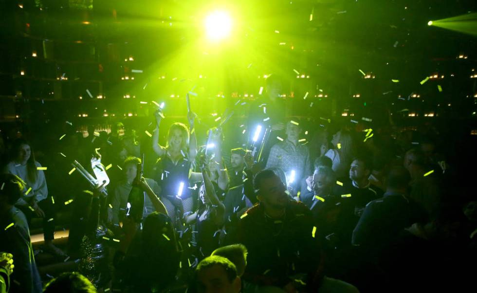 Conventioneers and clubgoers during the CES 2020 official opening party in the Main Room at Omn ...