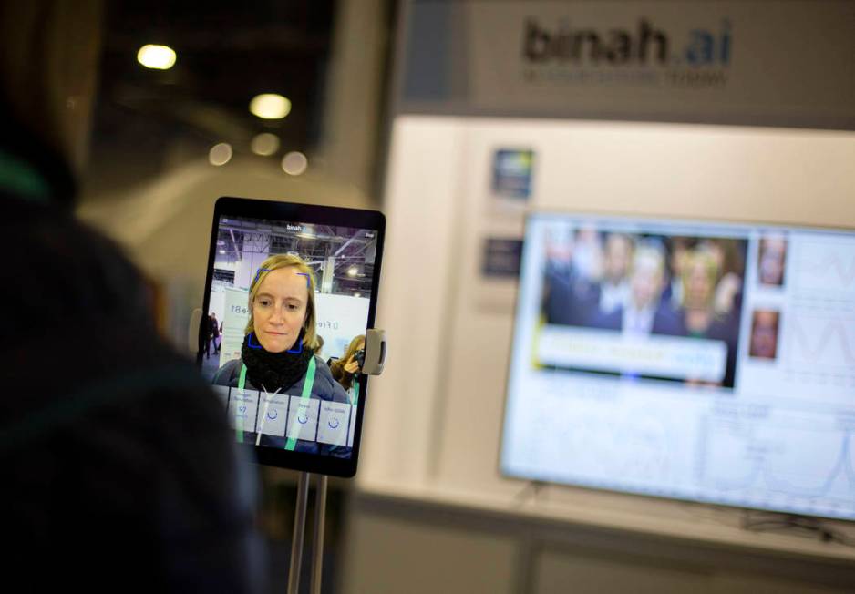 Claire Thelliez of Paris, France tries out the Binah.ai app on Wednesday, Jan. 8, 2020, at CES ...