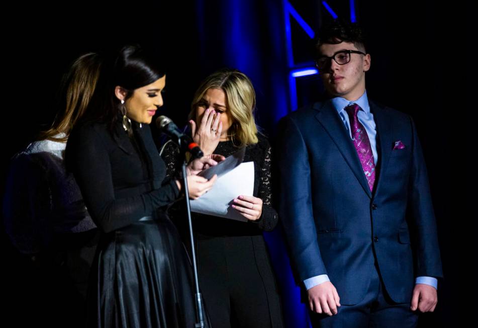 Thalia Trentacarlini, center, and brother, Gabriel, right, react as sister, Isabella, talks abo ...