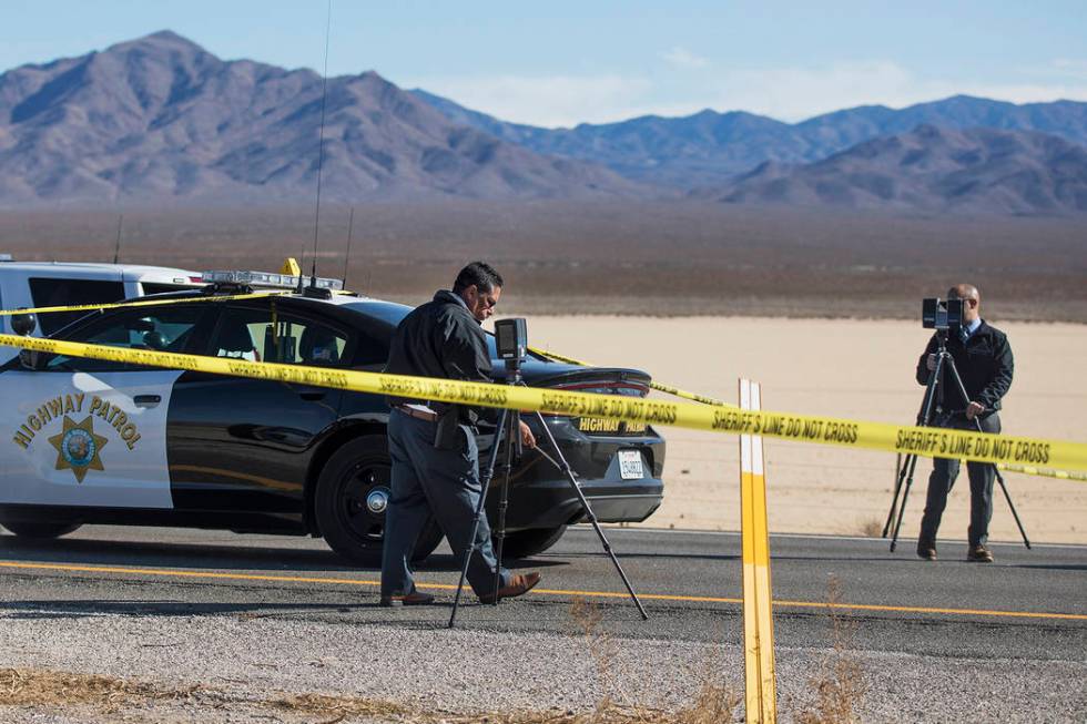 Police work the scene of a fatal officer-involved shooting south of Primm on northbound Interst ...