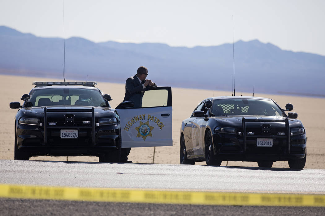 Police work the scene of a fatal officer-involved shooting south of Primm on northbound Interst ...