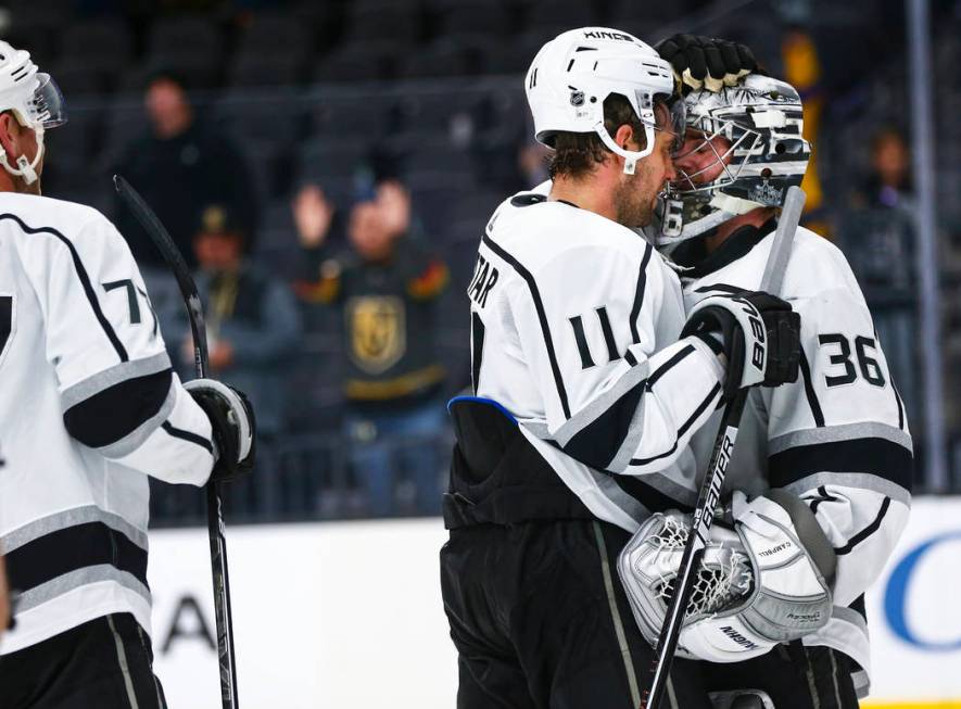 Los Angeles Kings' Anze Kopitar (11) and goaltender Jack Campbell (36) celebrate their team's w ...