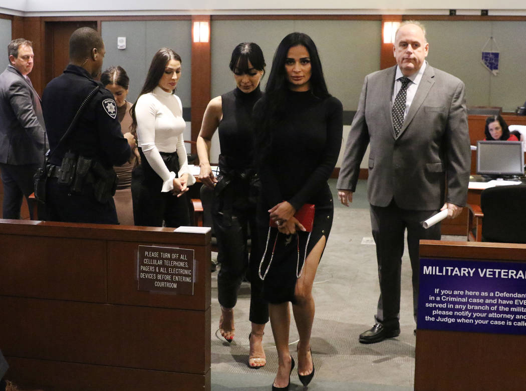 Four women, accused of an attack involving shoes at the Cosmopolitan, leave the courtroom with ...