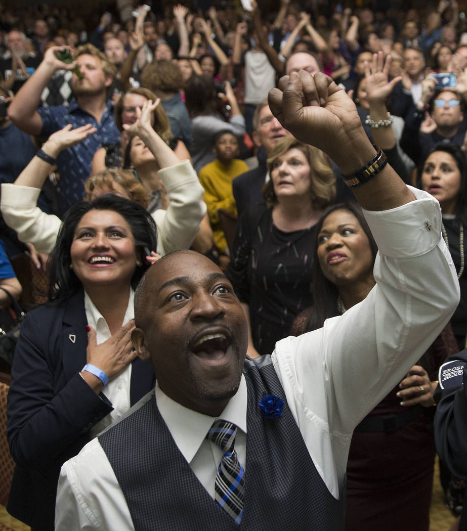 Assemblyman Tyrone Thompson,center, cheers as results come in for Congresswoman Jacky Rosen dur ...