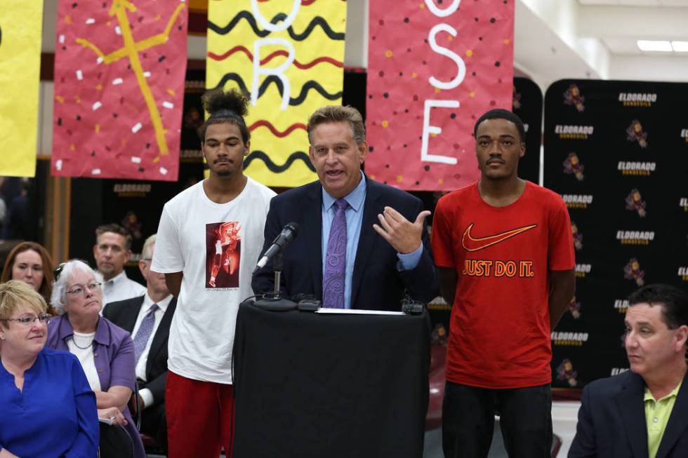 Eldorado High School Principal David Wilson, seen speaking as Ryan Johnson, left, and Royale Da ...