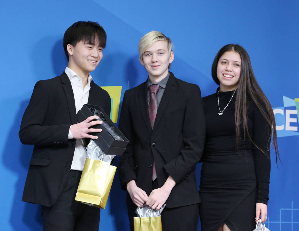 Local Las Vegas students James Wang, 16, left, Josh Ferguson, 18, center, and Gabrielle Florato ...