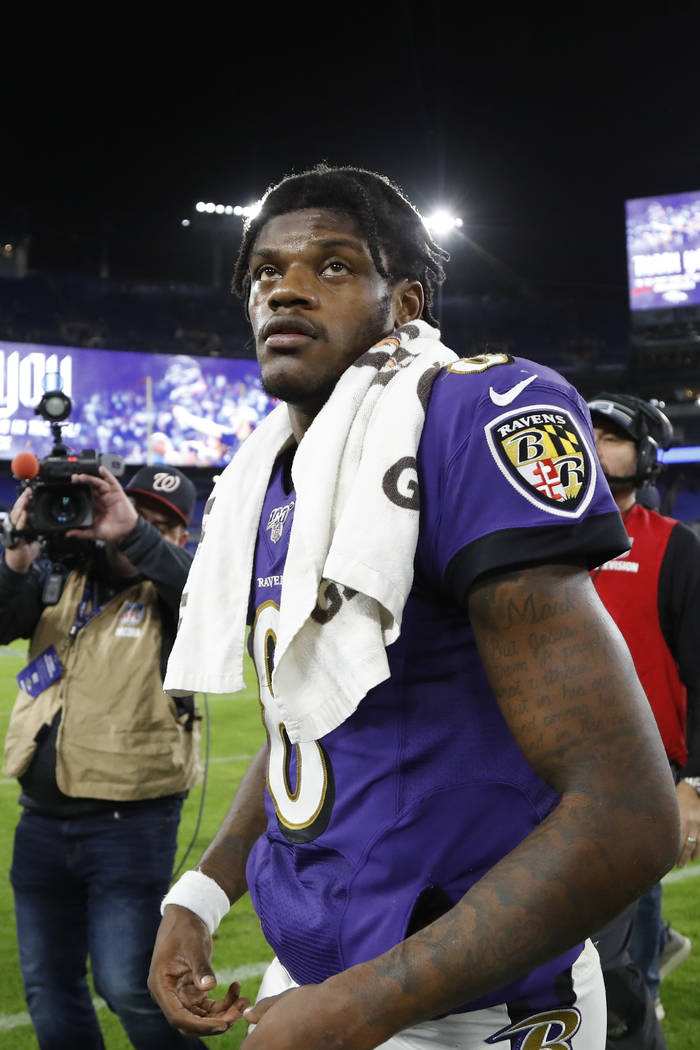 Baltimore Ravens quarterback Lamar Jackson leaves the field after an NFL divisional playoff foo ...