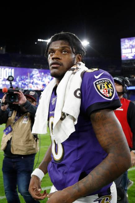 Baltimore Ravens quarterback Lamar Jackson leaves the field after an NFL divisional playoff foo ...