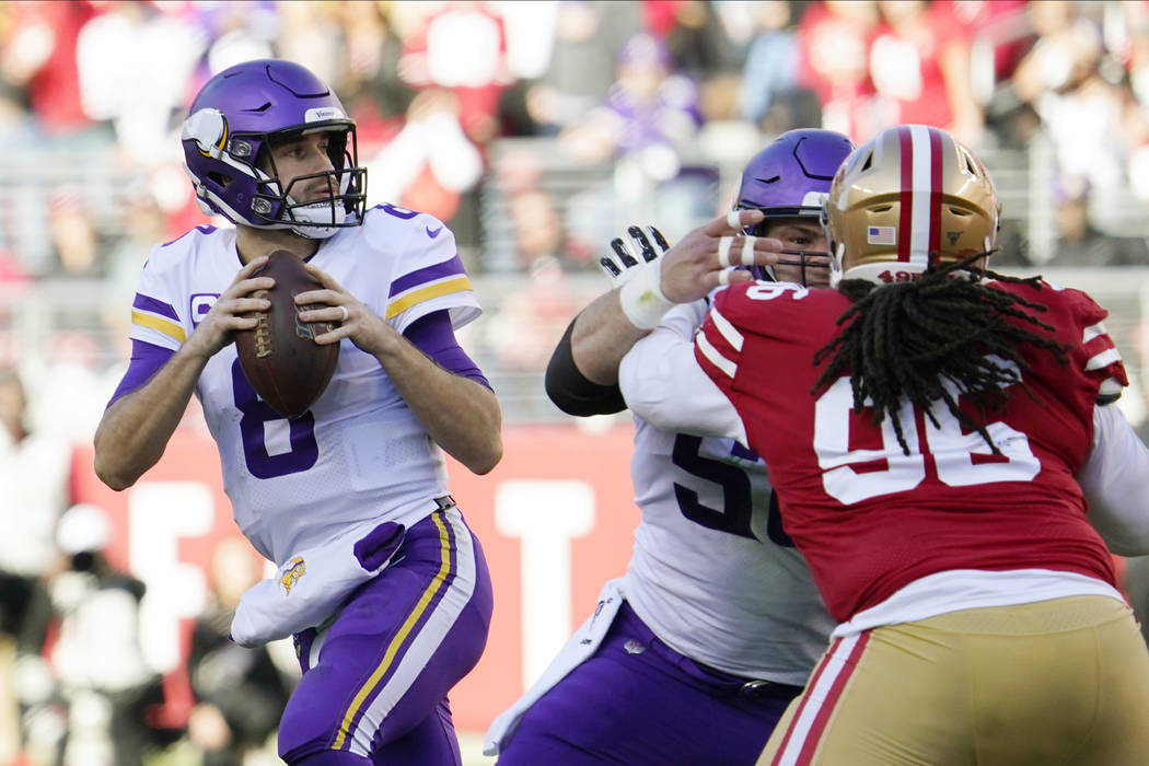 Minnesota Vikings quarterback Kirk Cousins (8) drops back to pass against the San Francisco 49e ...