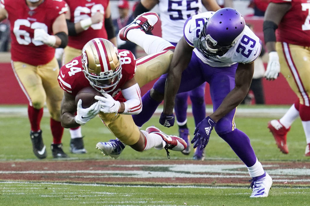 San Francisco 49ers wide receiver Kendrick Bourne (84) catches a pass ahead of Minnesota Viking ...