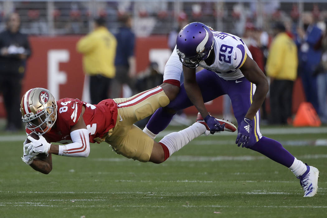 San Francisco 49ers wide receiver Kendrick Bourne (84) falls to the ground after catching a pas ...