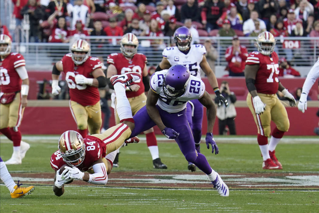 San Francisco 49ers wide receiver Kendrick Bourne (84) catches a pass ahead of Minnesota Viking ...