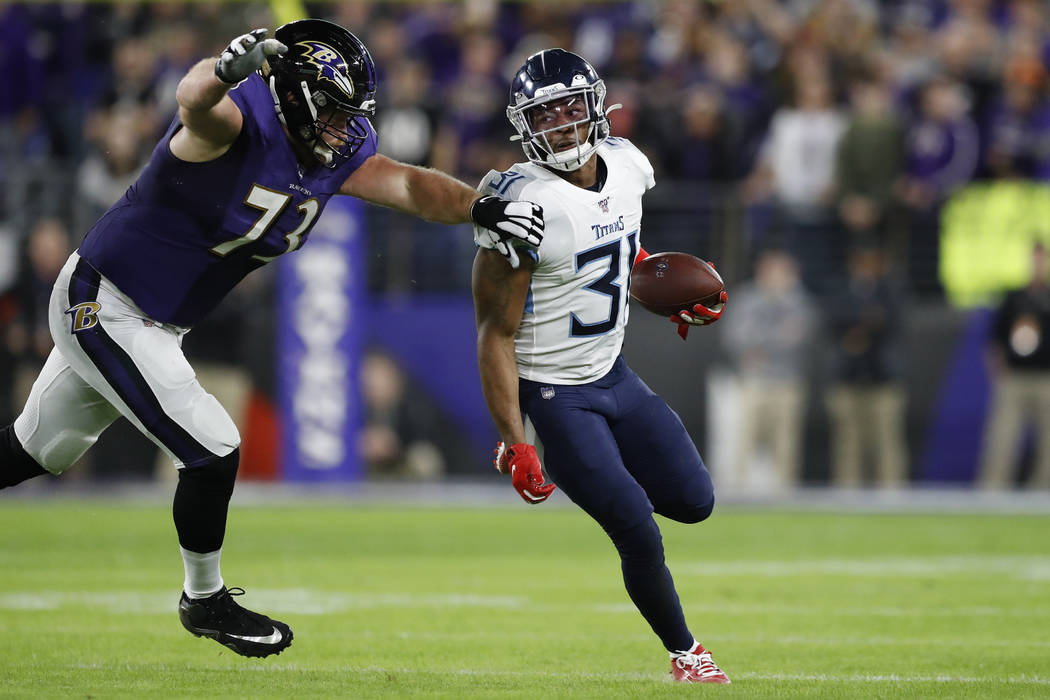 Tennessee Titans free safety Kevin Byard (31) moves past Baltimore Ravens offensive guard Marsh ...