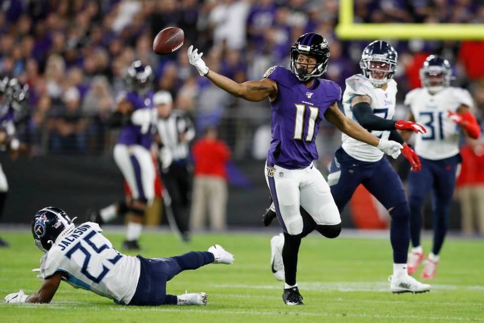 Baltimore Ravens wide receiver Seth Roberts (11) can't catch a pass as he is covered by Tenness ...