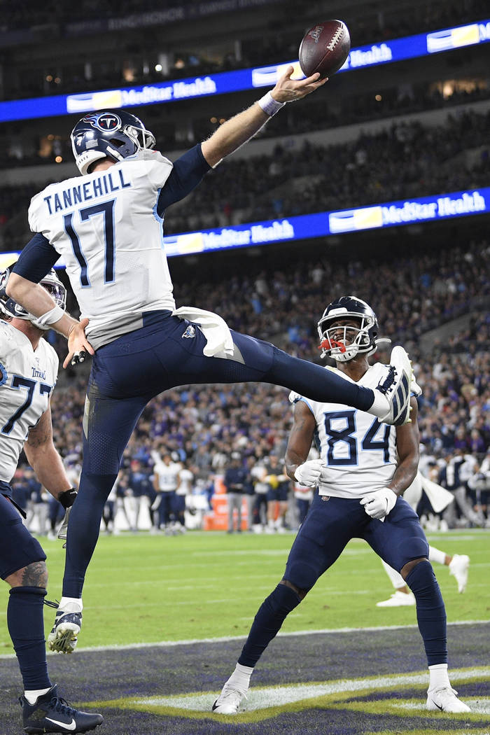 Tennessee Titans quarterback Ryan Tannehill (17) celebrates his touchdown against the Baltimore ...