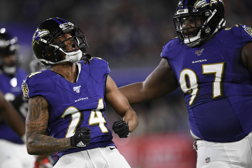 Baltimore Ravens cornerback Marcus Peters (24) reacts to a play against the Tennessee Titans du ...