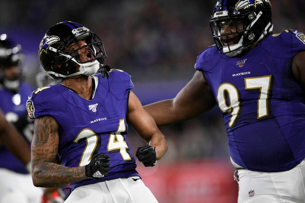 Baltimore Ravens cornerback Marcus Peters (24) reacts to a play against the Tennessee Titans du ...