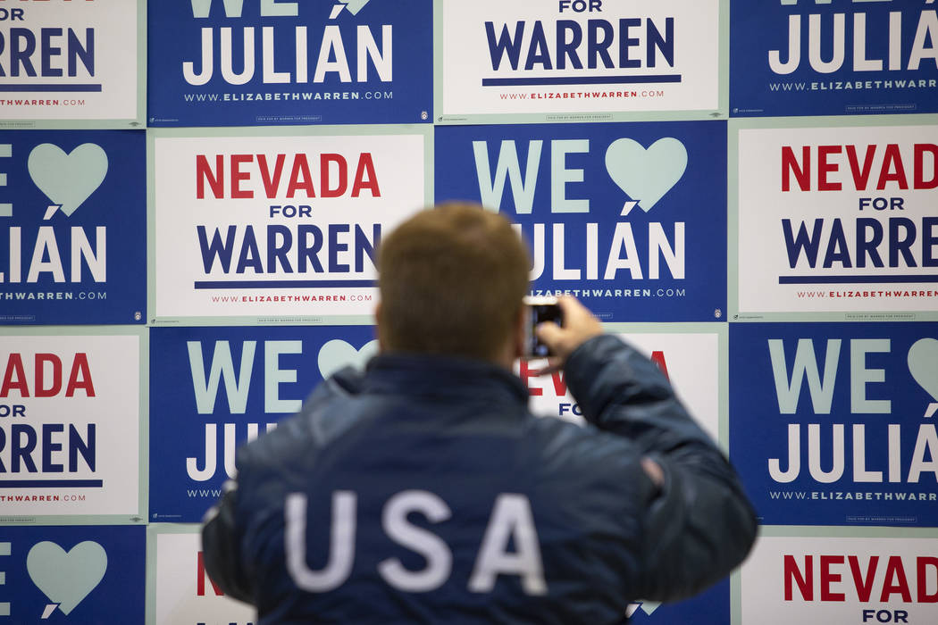 A Julian Castro supporter photographs the new signage singe the former presidential candidate a ...