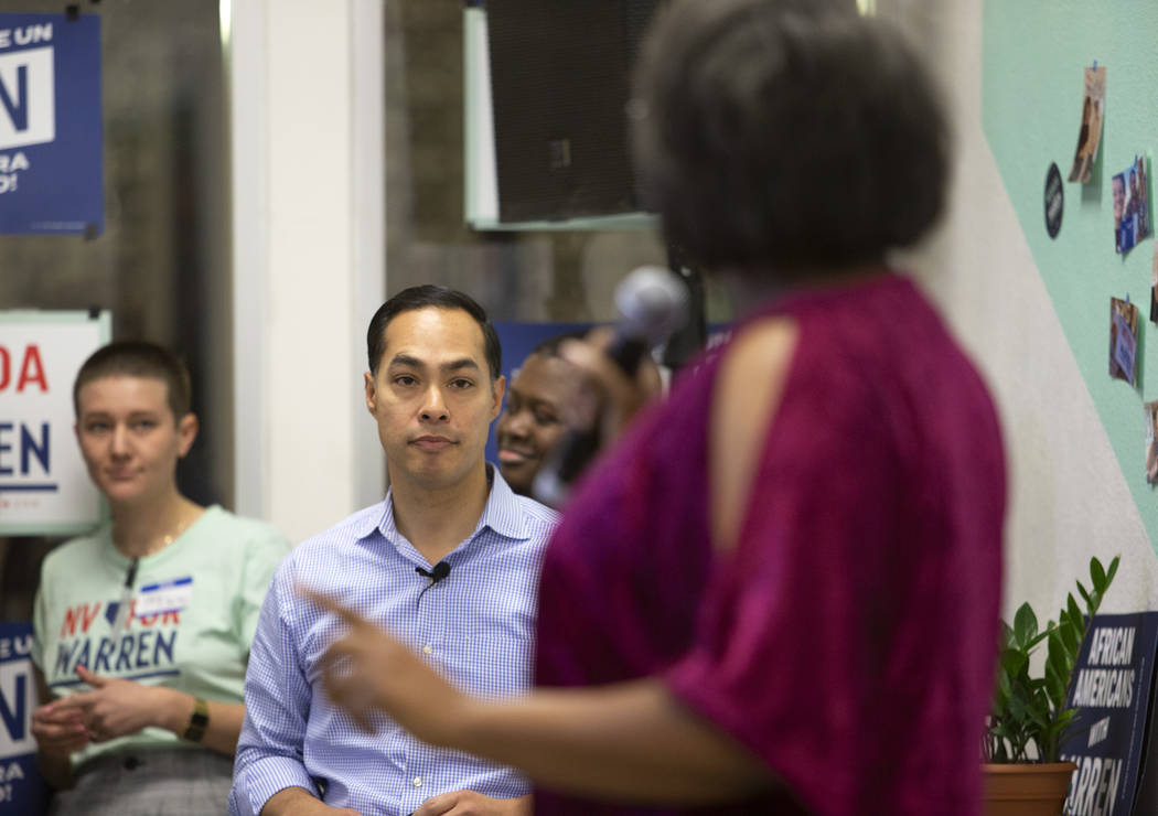 Julian Castro listens as DNC committeewoman Allison Stephens introduces him during an organizin ...