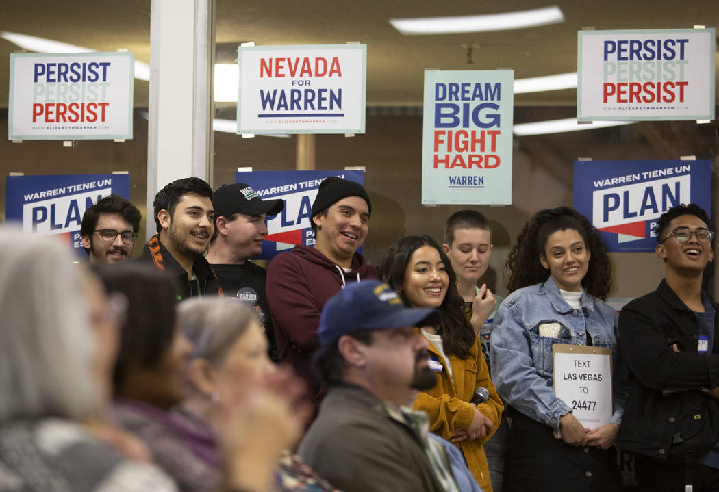 The audience at an organizing event for Elizabeth Warren's campaign laughs as Julian Castro spe ...
