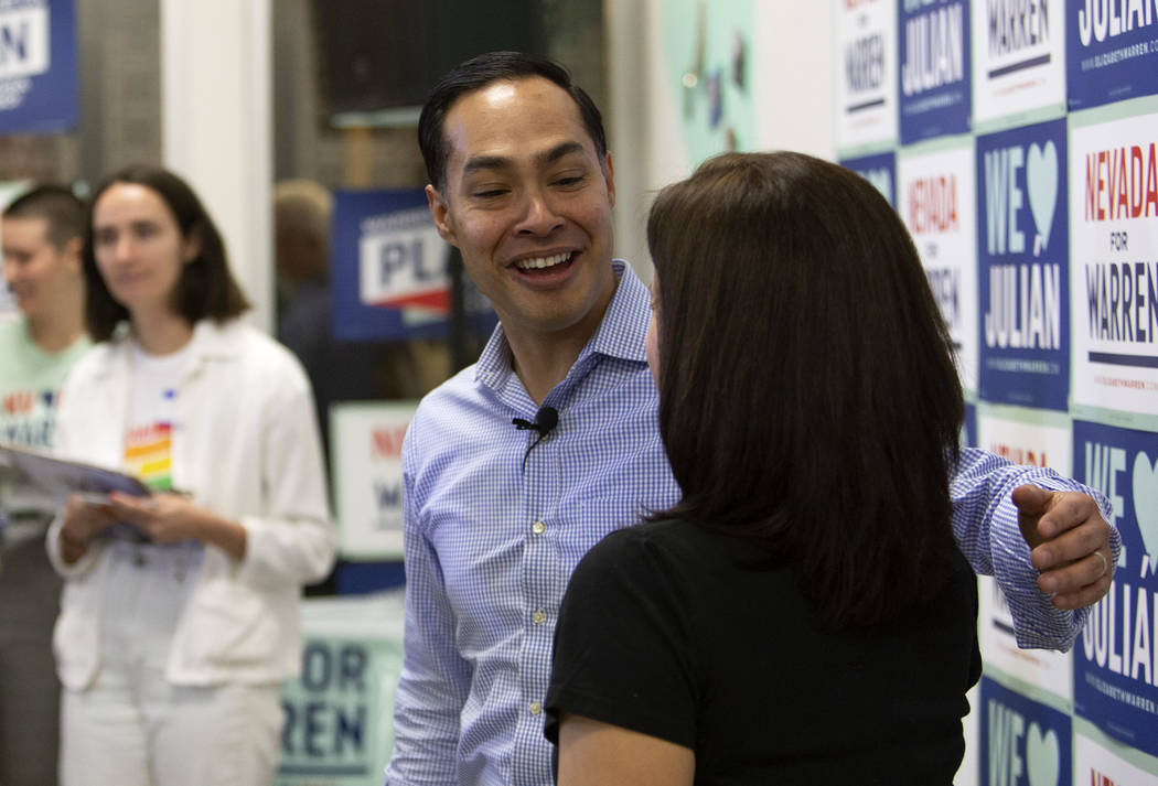 Julian Castro takes selfies with people who came to hear him speak at presidential candidate El ...