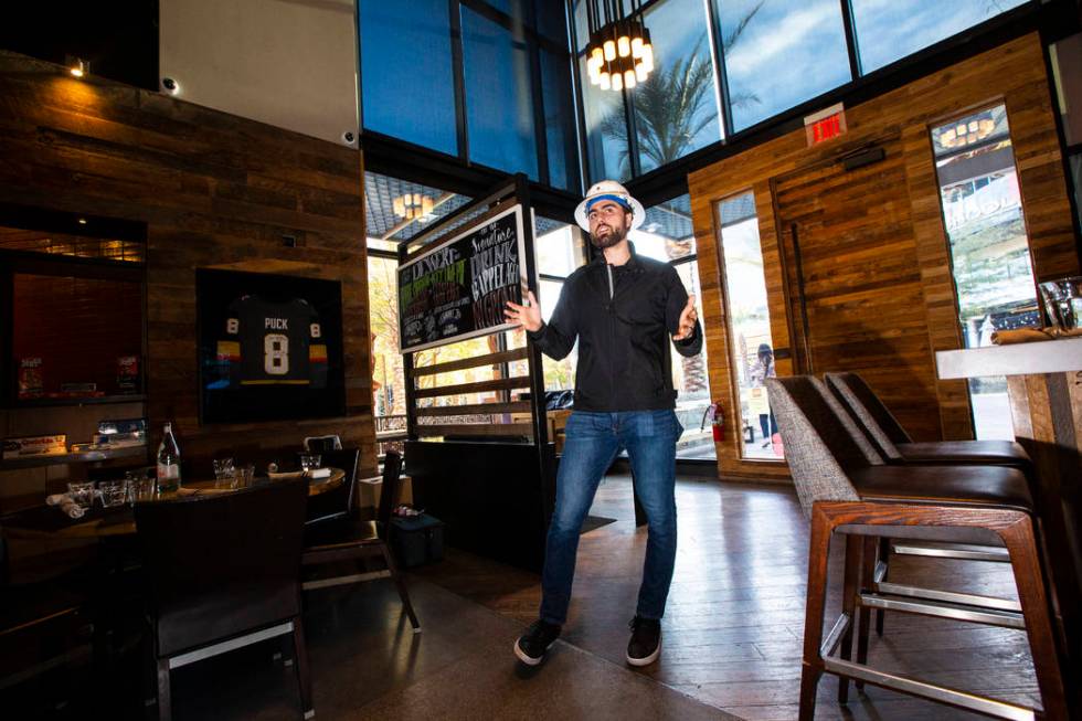 Golden Knights' Alex Tuch talks during a tour of the current Wolfgang Puck Bar & Grill spac ...