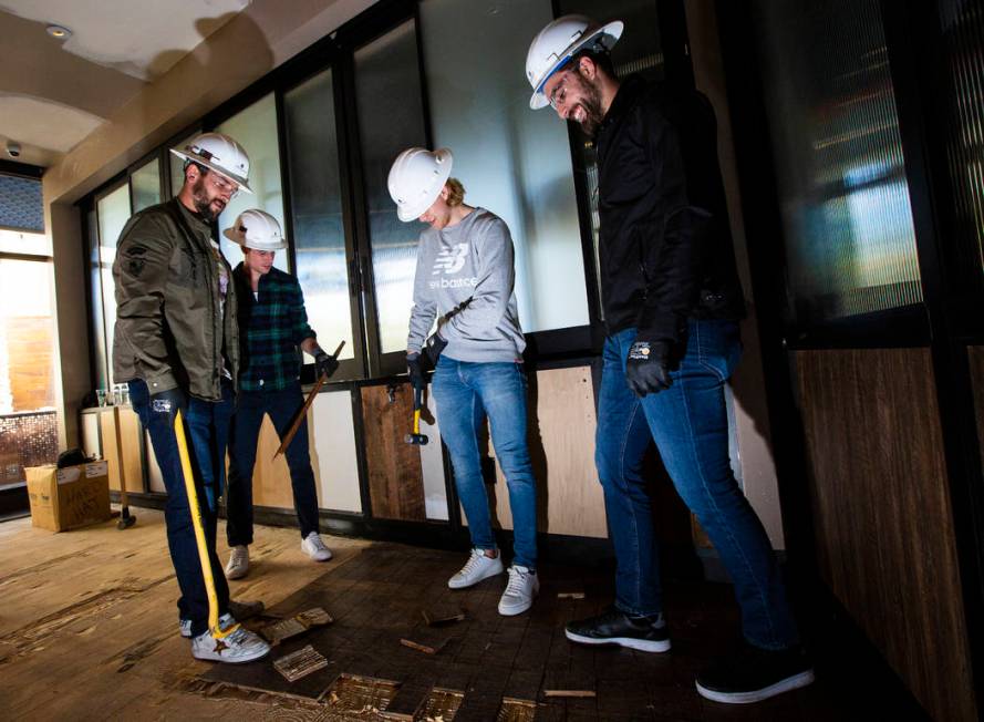 Golden Knights players, from left, Deryk Engelland, Reilly Smith, William Karlsson and Alex Tuc ...