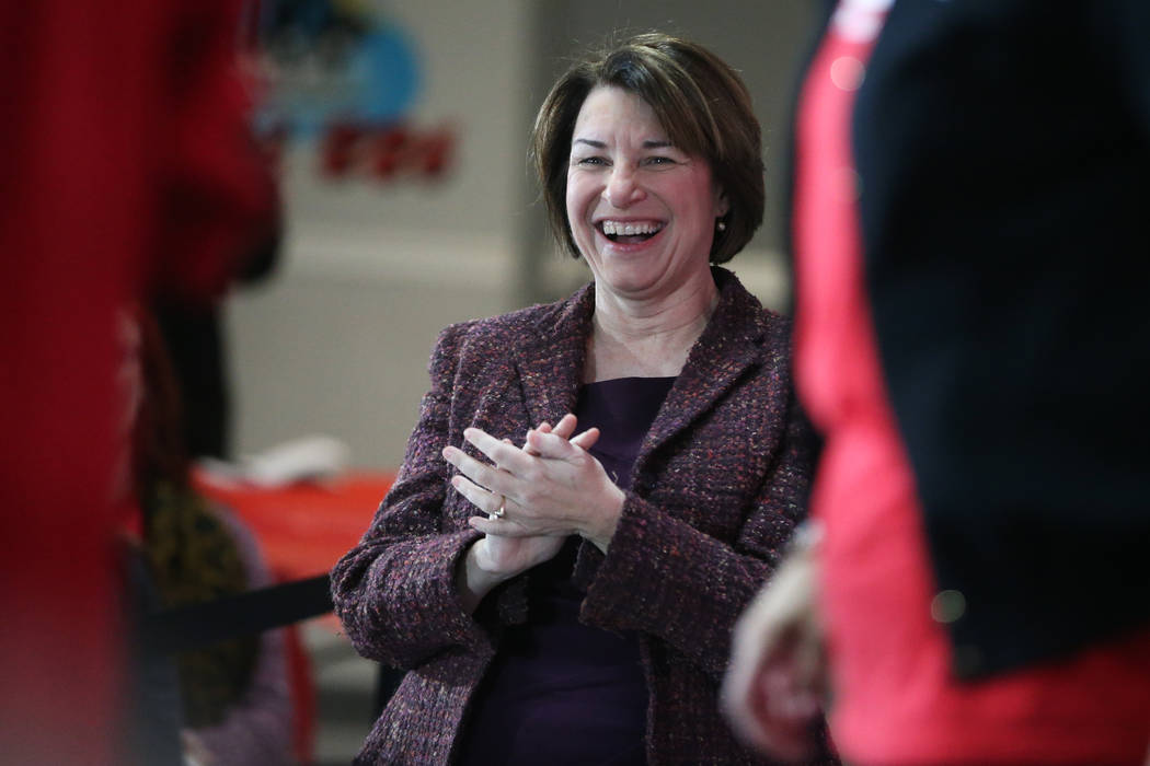 Democratic presidential candidate Amy Klobuchar gets ready to take the stage during a town hall ...