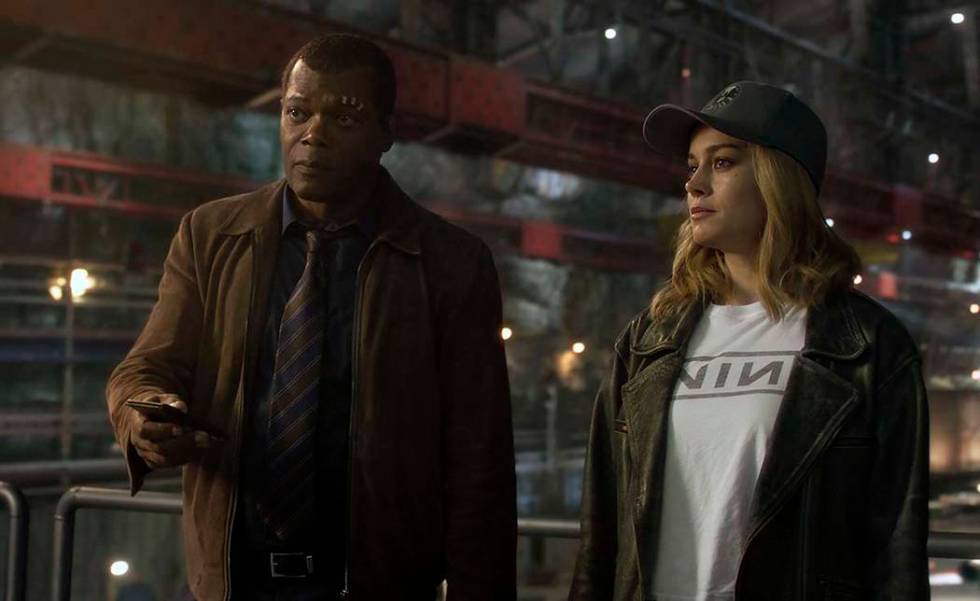 This image released by Disney-Marvel shows Samuel L. Jackson as a younger Nick Fury, left, and ...