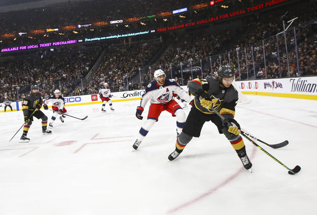 Golden Knights' William Karlsson (71) skates with the puck in front of Columbus Blue Jackets' S ...