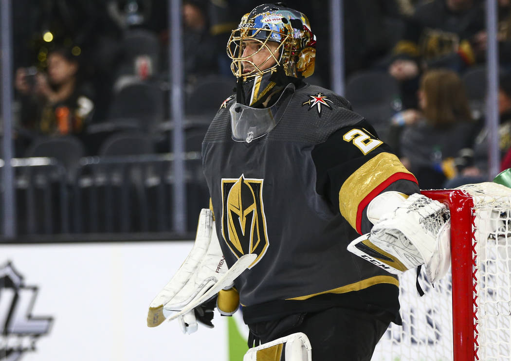 Golden Knights goaltender Marc-Andre Fleury (29) looks on before the start of the second period ...