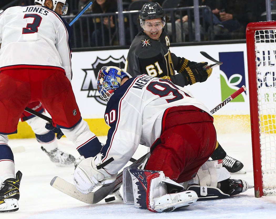 Columbus Blue Jackets goaltender Elvis Merzlikins (90) looks to stop the puck in front of Golde ...
