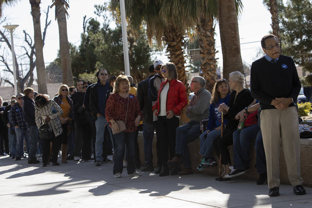 People wait in line to hear Joe Biden speak at a campaign event at Rancho High School on Saturd ...