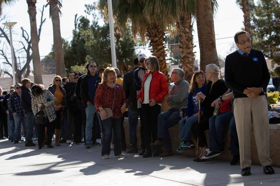 People wait in line to hear Joe Biden speak at a campaign event at Rancho High School on Saturd ...