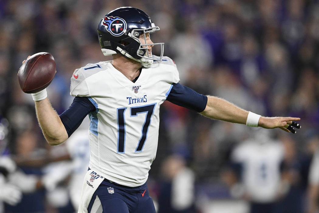 Tennessee Titans quarterback Ryan Tannehill (17) works against the Baltimore Ravens during an N ...