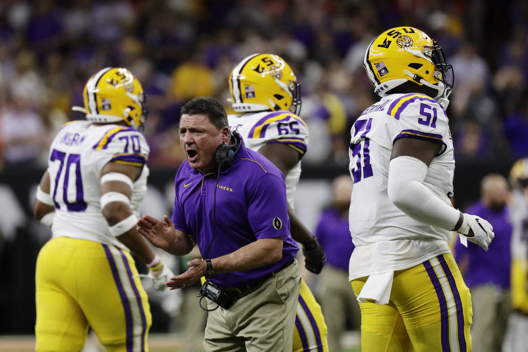 LSU head coach Ed Orgeron cheers during the first half of a NCAA College Football Playoff natio ...