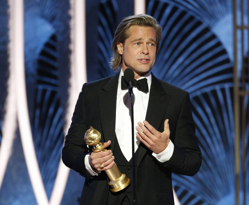 This image released by NBC shows Brad Pitt accepting the award for best supporting actor in a f ...