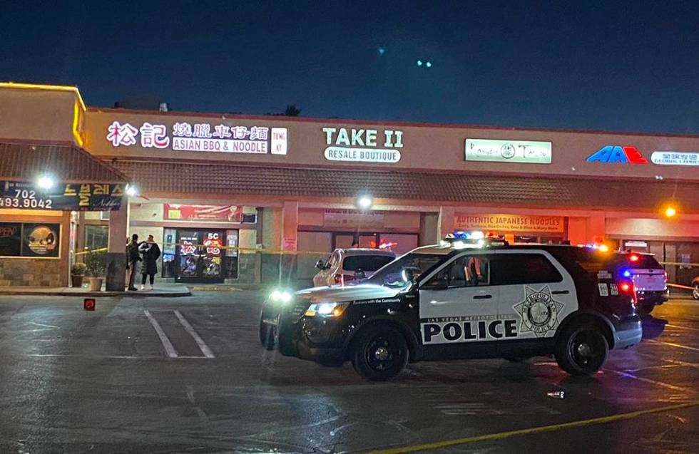 Las Vegas police investigate a shooting in front of a restaurant in the 3400 block of South Jon ...