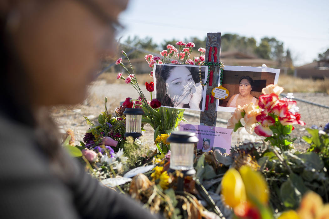 Andrea Lopez puts fresh tulips at the memorial on Monday, Jan. 13, 2020, at the spot where her ...