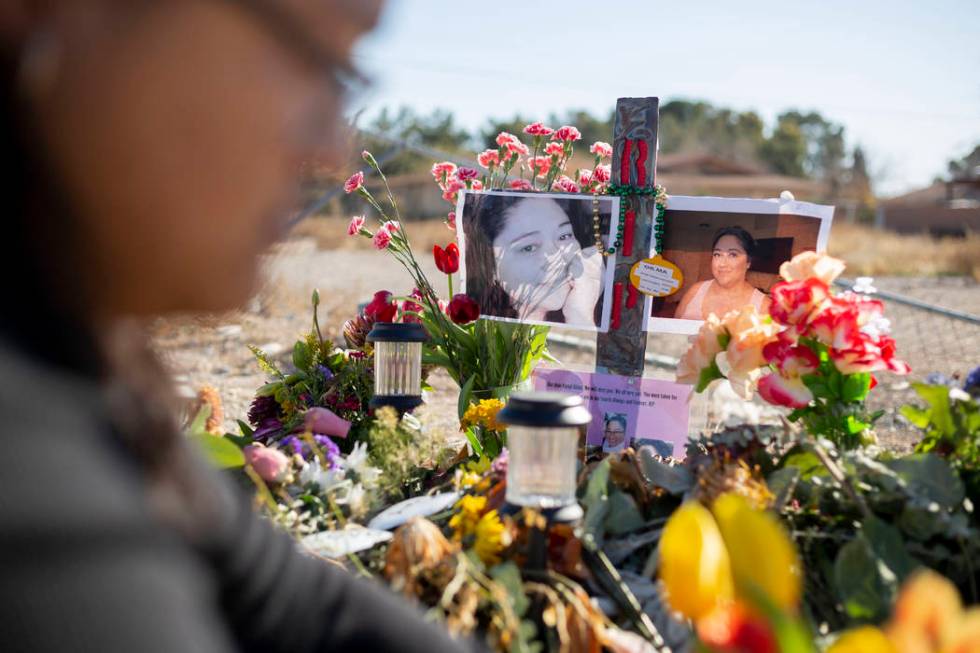 Andrea Lopez puts fresh tulips at the memorial on Monday, Jan. 13, 2020, at the spot where her ...