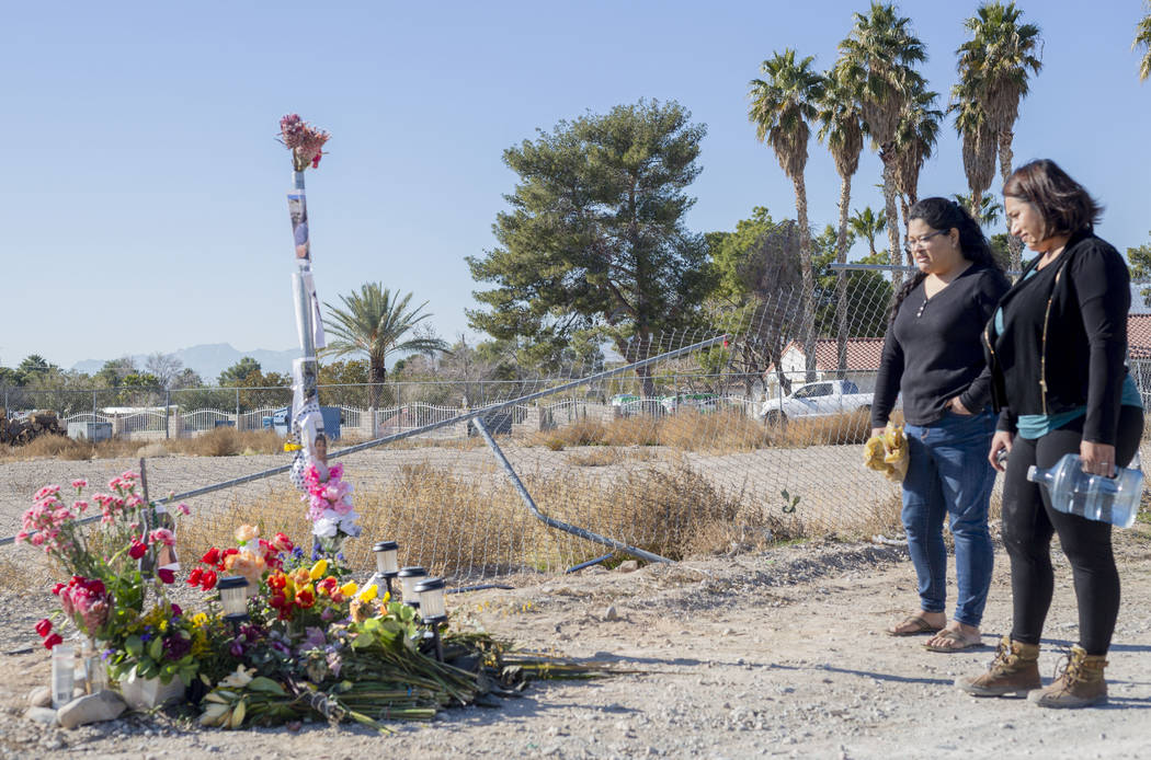 Sisters Andrea Lopez, left, and Ruth Neall look at the memorial on Monday, Jan. 13, 2020, at th ...