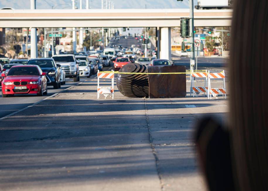 An SUV crashed into and knocked over one of two "Norte Y Sur" steel head sculptures in the medi ...