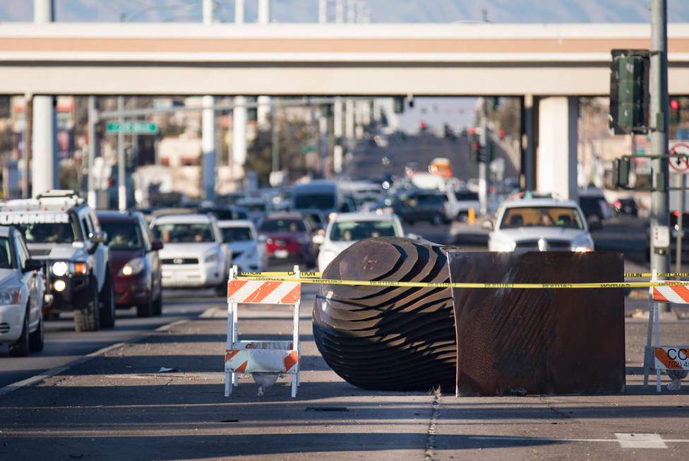 An SUV crashed into and knocked over one of two "Norte Y Sur" steel head sculptures in the medi ...